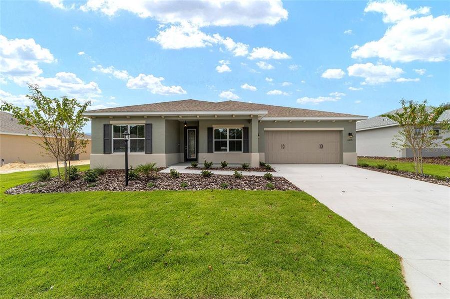 Front exterior of a new home in On Top of the World Communities, Ocala, FL, highlighting curb appeal (Image 20).