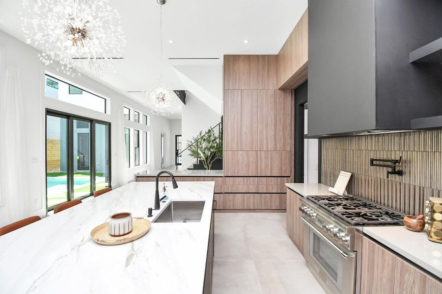 Gas range with 6 burners and a pot filler.