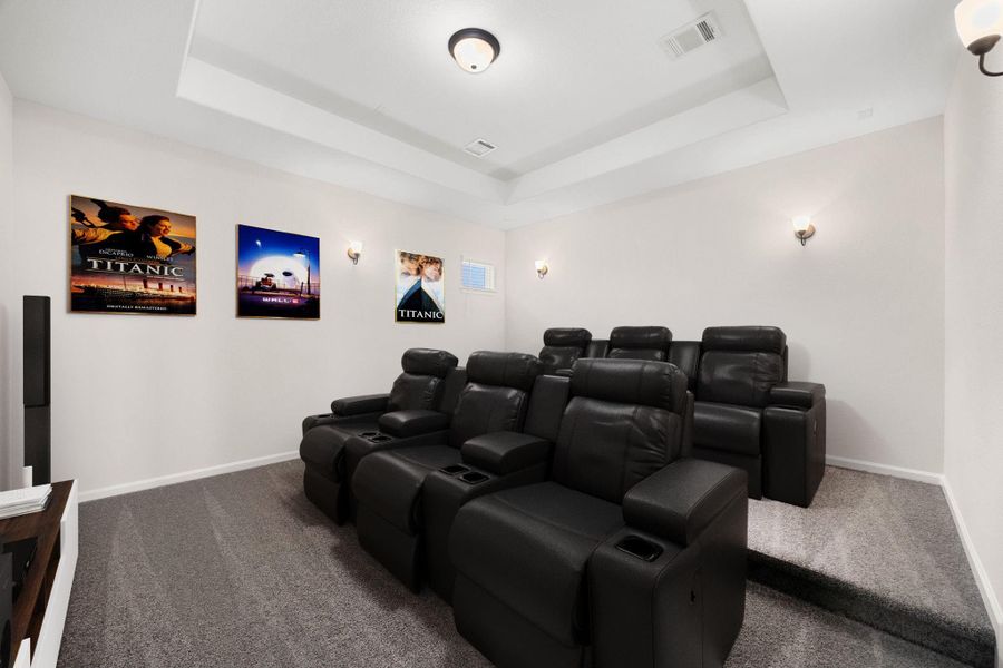 Fully equipped private home theater / media room designed for the ultimate movie-night experience. This spectacular entertainment space features a multi-level tiered seating layout with plush carpeting, deep tray ceiling architectural framing, and dimmable classic wall sconces to set the perfect cinema mood. Wire-managed and spacious, this room easily accommodates two full rows of deluxe theater recliners and a massive projection screen or media console. *Virtually Staged Fully equipped private home theater / media room designed for the ultimate movie-night experience. This spectacular entertainment space features a multi-level tiered seating layout with plush carpeting, deep tray ceiling architectural framing, and dimmable classic wall sconces to set the perfect cinema mood. Wire-managed and spacious, this room easily accommodates two full rows of deluxe theater recliners and a massive projection screen or media console. *Virtually Staged