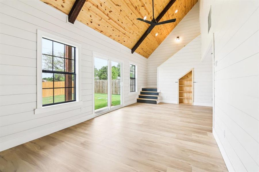 Additional living room and stair view