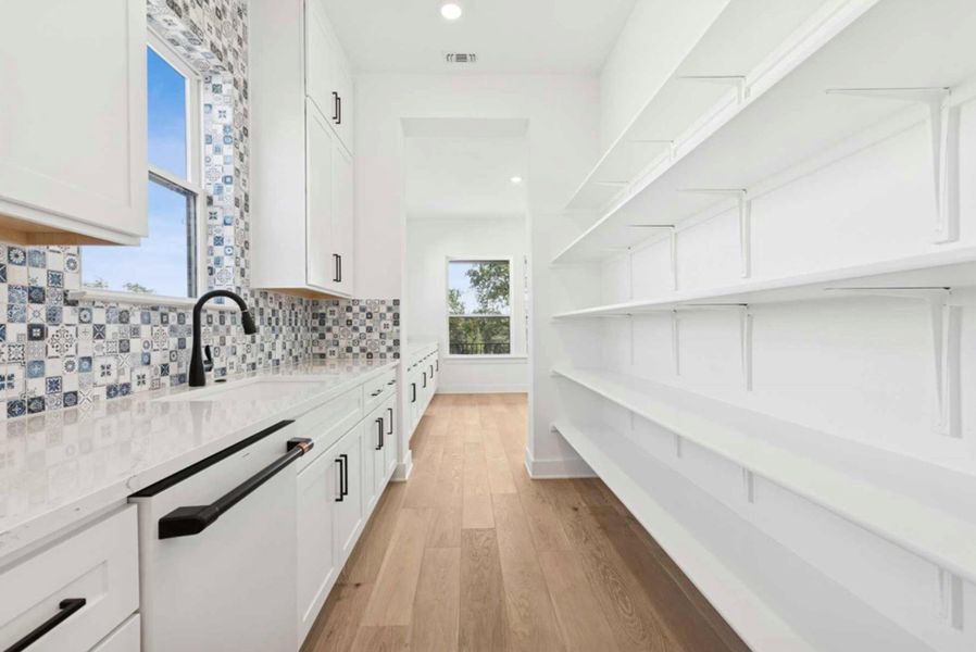 Butler's pantry is behind the kitchen.