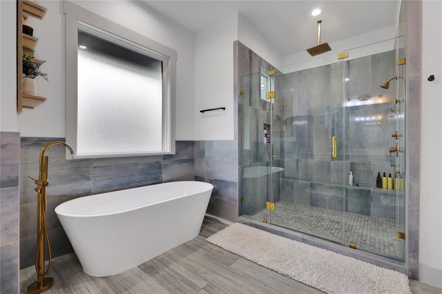 Bubbles are for Friday nights! Bring your wine glass and relax right here! I love the fixtures! This oversized shower with all the bells and whistles will be sauna-like!