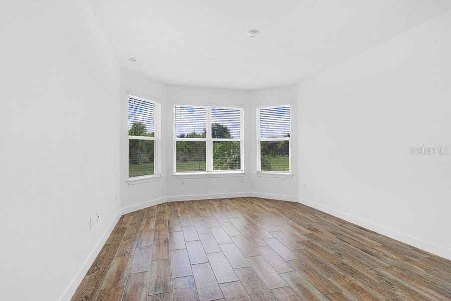 Spacious, unfurnished interior of a new home in Esplanade at Artisan Lakes, Palmetto (Image 32).