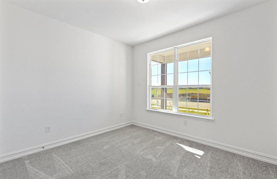 First floor bedroom with a bright window view First floor bedroom with a bright window view
