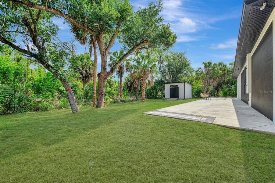 Exterior details and patio area of a home in , North Port (Image 43).