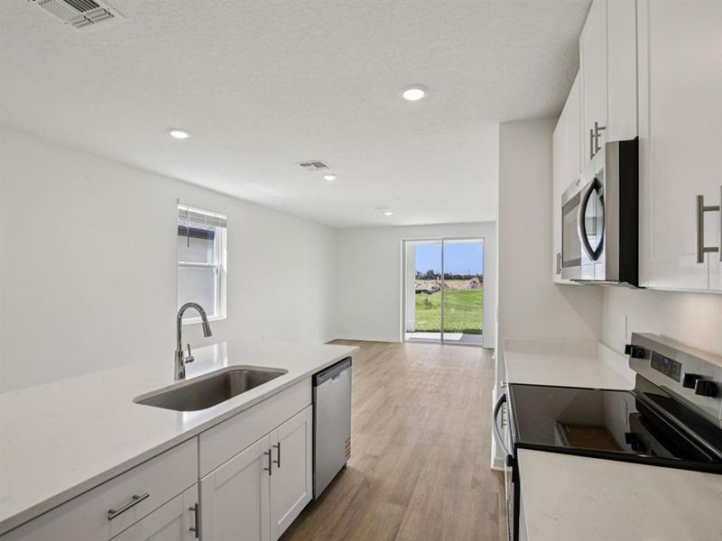 Furnished interior view inside a new home in The Grove at Stuart Crossing - Premier Series, Bartow (Image 3).