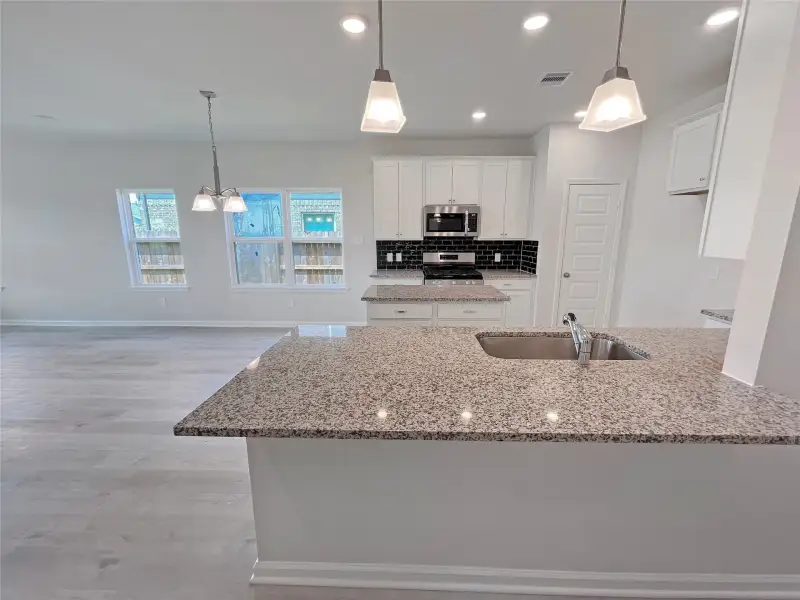 The Georgetown II- Foyer into Kitchen. Sample image for illustration; upgrades, options, and colors may vary.