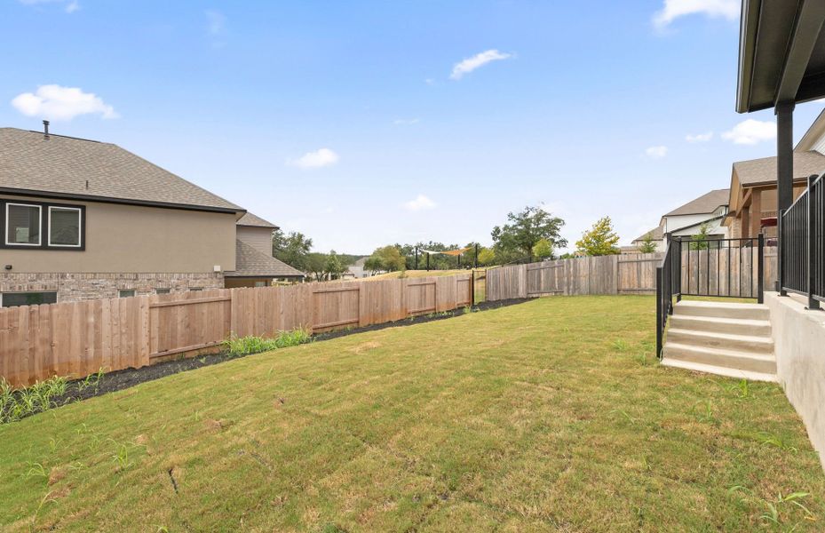 Exterior details and patio area of a home in Bluffview Reserve, Leander (Image 24).