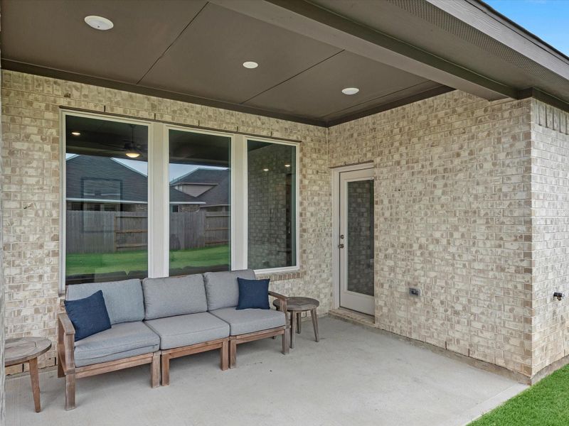 Exterior details and patio area of a home in Mason Woods, Cypress (Image 3).