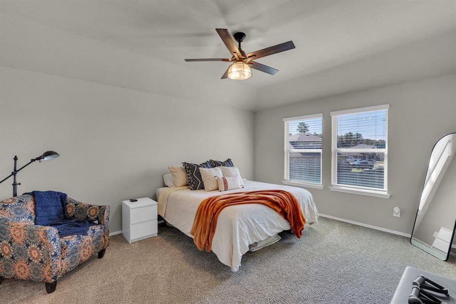 Primary bedroom, the fourth bedroom in a split layout, offers a private retreat away from the other three bedrooms. Featuring double windows that flood the space with natural light, this generously sized room provides plenty of room for relaxation and personalization.