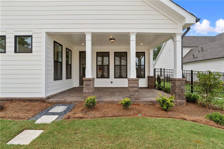 Exterior details and patio area of a home in Promenade at Sawnee Village, Cumming (Image 4).