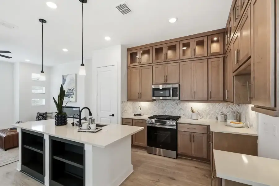 Representative furnished interior of a home built from the Calypso by Chesmar Homes in Centero at Stone Oak, San Antonio (Image 8).