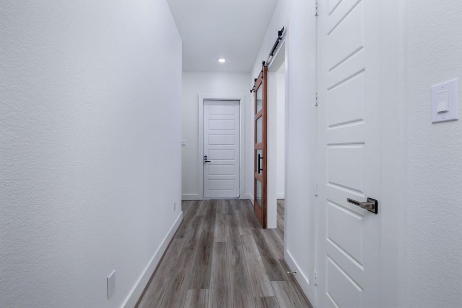Hall way into the garage and front office