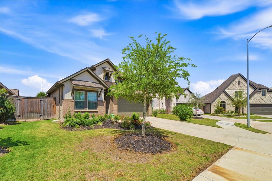Front exterior of a new home in Candela, Richmond, TX, highlighting curb appeal (Image 26).