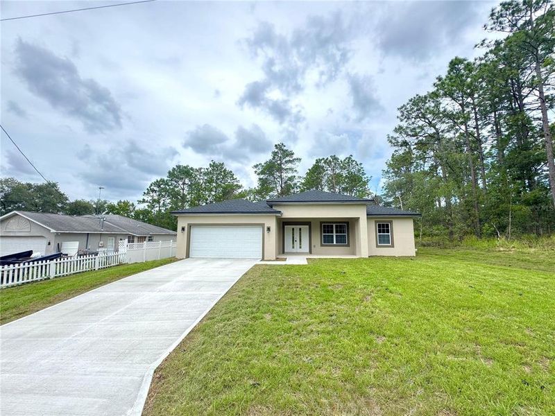 Front exterior of a new home in , Citrus Springs, FL, highlighting curb appeal (Image 19).