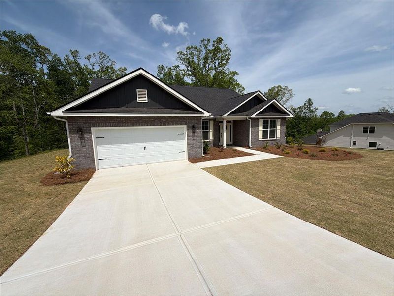 Front exterior of a new home in Tuscany Hills, Douglasville, GA, highlighting curb appeal (Image 19).