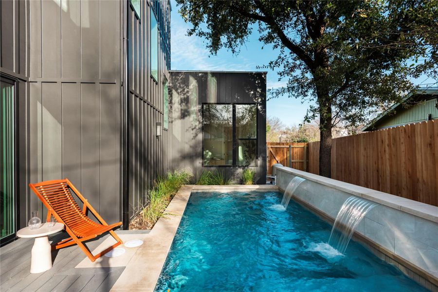 View of swimming pool with a fenced in pool and a fenced backyard