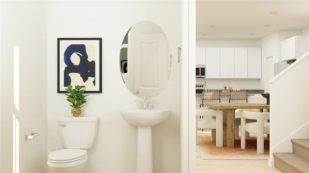 Bathroom featuring light wood-style floors and toilet