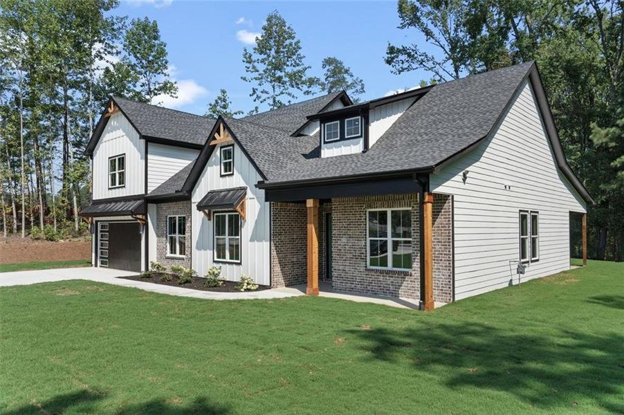 Front exterior of a new home in , Powder Springs, GA, highlighting curb appeal (Image 1). Front exterior of a new home in , Powder Springs, GA, highlighting curb appeal (Image 1).
