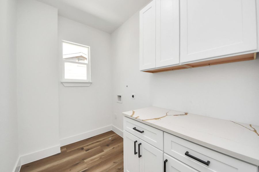 Laundry in the second floor with counter space