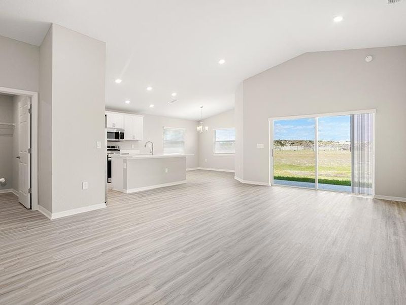 This home features a sunny, open living area with volume ceilings - Sophia by Highland Homes