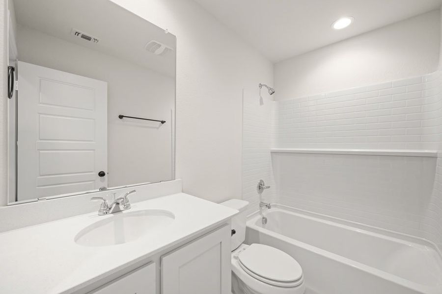 Front exterior of a new home in Baker Farms, Cleburne, TX, highlighting curb appeal (Image 11). Front exterior of a new home in Baker Farms, Cleburne, TX, highlighting curb appeal (Image 11).