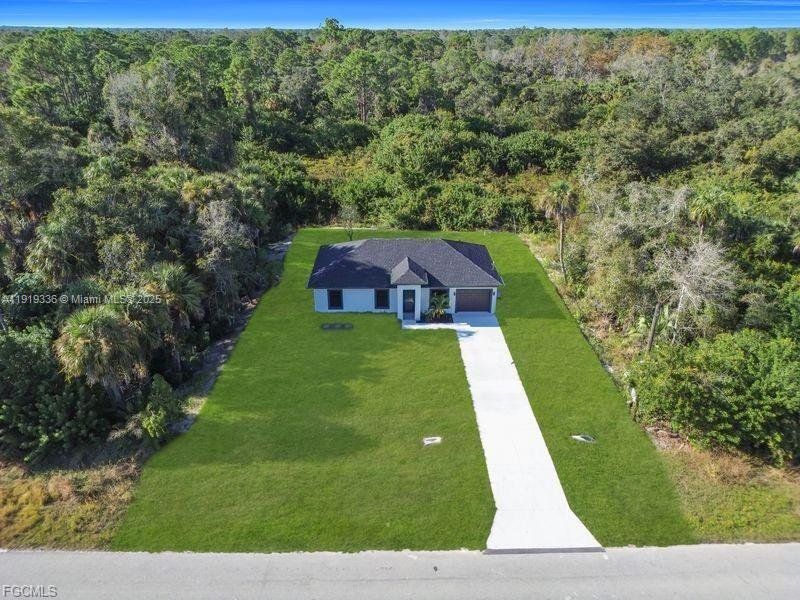 Front exterior of a new home in , Lehigh Acres, FL, highlighting curb appeal (Image 22). Front exterior of a new home in , Lehigh Acres, FL, highlighting curb appeal (Image 22).