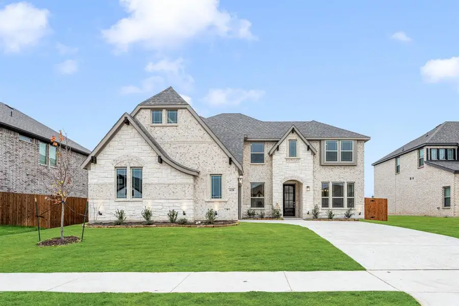 Front exterior of a new home in Sunrise at Garden Valley, Waxahachie, TX, highlighting curb appeal (Image 2).