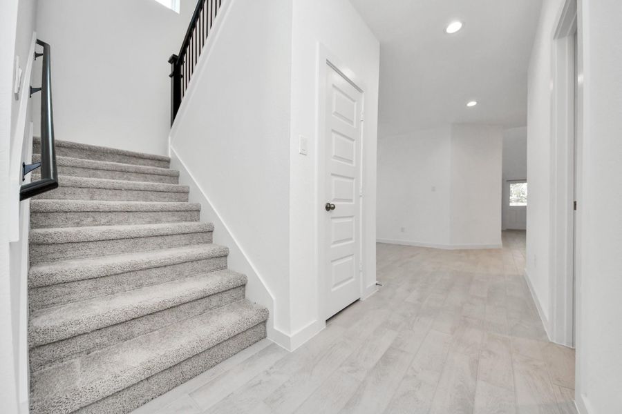 Ascend to relaxation in this fantastic game room! Ideal for both casual gatherings and adult gaming, it boasts plush carpet, lofty ceilings, custom paint, and ample windows for abundant natural light. Sample photo of completed home with similar floor plan. Actual colors and selections may vary. Ascend to relaxation in this fantastic game room! Ideal for both casual gatherings and adult gaming, it boasts plush carpet, lofty ceilings, custom paint, and ample windows for abundant natural light. Sample photo of completed home with similar floor plan. Actual colors and selections may vary.