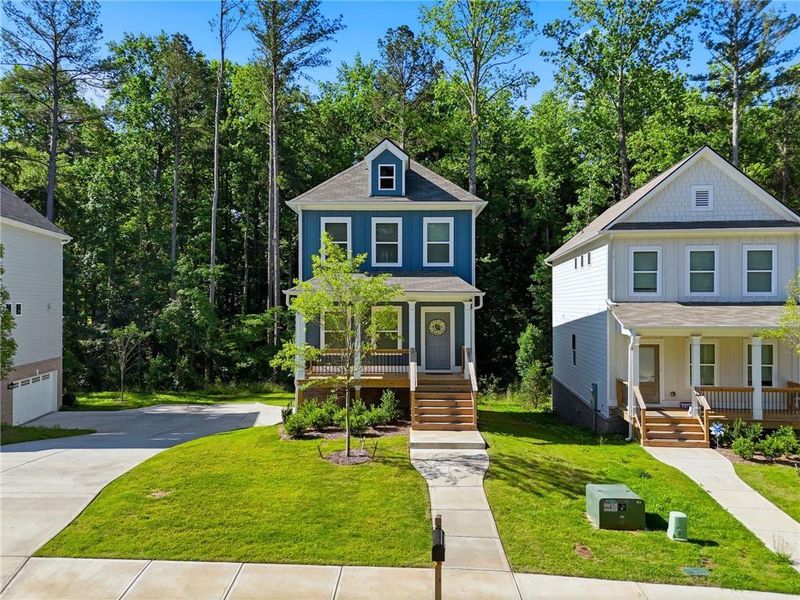 Front exterior of a new home in , Woodstock, GA, highlighting curb appeal (Image 26). Front exterior of a new home in , Woodstock, GA, highlighting curb appeal (Image 26).