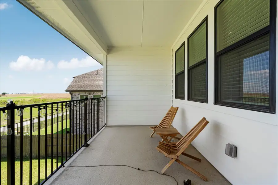 Overlooking expansive fields, this airy covered patio provides a peaceful retreat for outdoor enjoyment. Overlooking expansive fields, this airy covered patio provides a peaceful retreat for outdoor enjoyment.