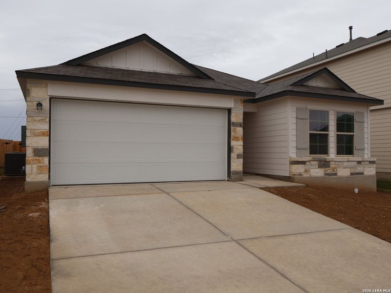 Front exterior of a new home in Agave, San Antonio, TX, highlighting curb appeal (Image 20). Front exterior of a new home in Agave, San Antonio, TX, highlighting curb appeal (Image 20).