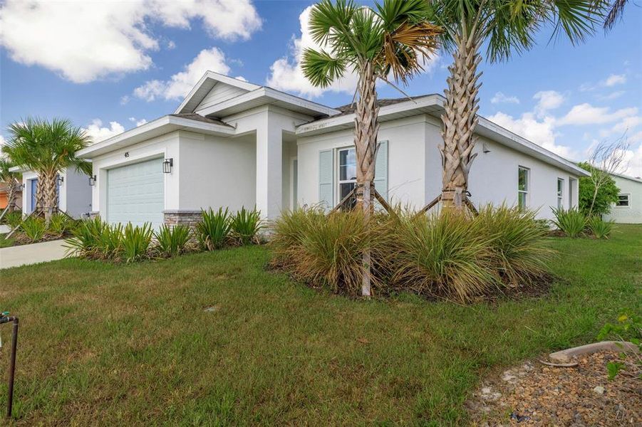 Front exterior of a new home in , Port Charlotte, FL, highlighting curb appeal (Image 2). Front exterior of a new home in , Port Charlotte, FL, highlighting curb appeal (Image 2).