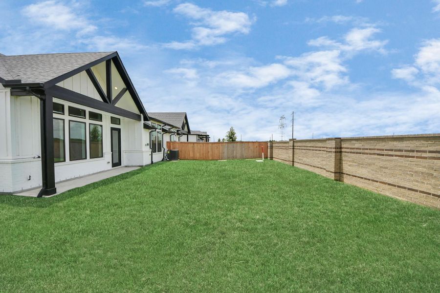 Front exterior of a new home in Bridgeland: Signature Collection, Cypress, TX, highlighting curb appeal (Image 18). Front exterior of a new home in Bridgeland: Signature Collection, Cypress, TX, highlighting curb appeal (Image 18).