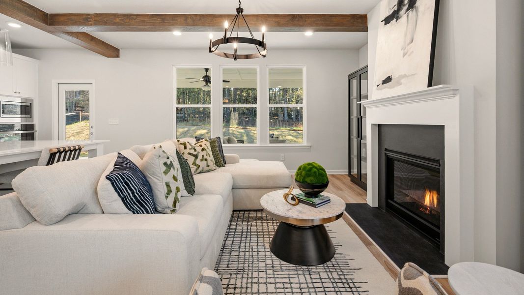 Gathering room with accent ceiling, fireplace, and windows Gathering room with accent ceiling, fireplace, and windows