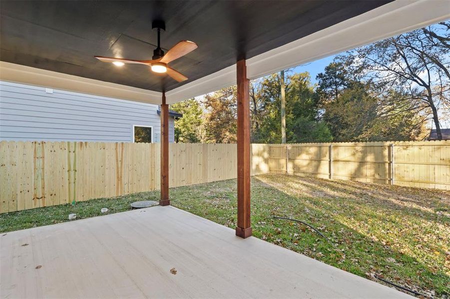 View of patio featuring ceiling fan