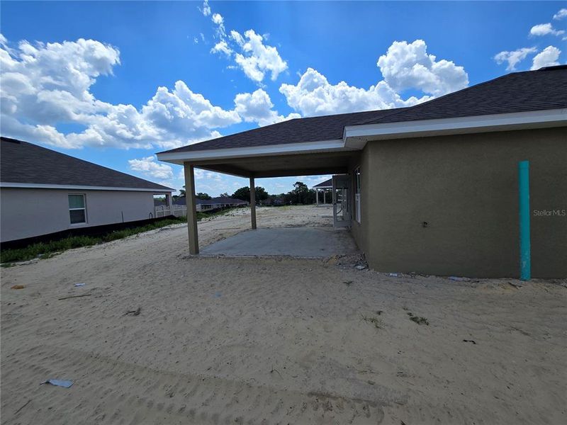 Front exterior of a new home in Twisted Oaks, Beverly Hills, FL, highlighting curb appeal (Image 13).