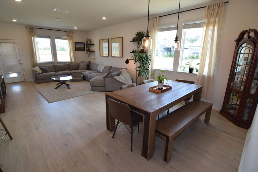An open floorplan design seamlessly connects the spacious dining area to the main living space.