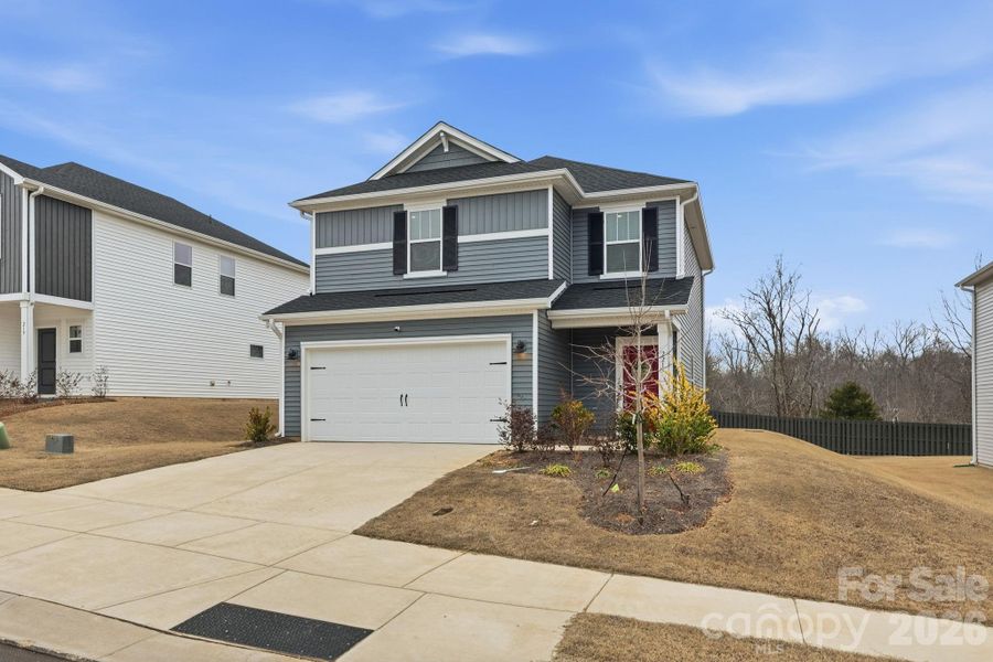 Front exterior of a new home in , Shelby, NC, highlighting curb appeal (Image 24).