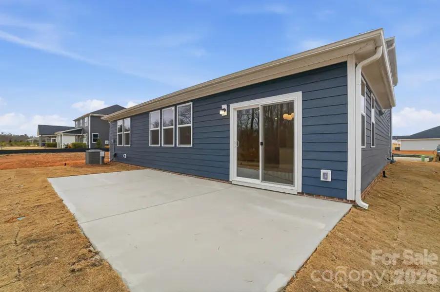 Exterior details and patio area of a home in Wellington Pointe Executive, Monroe (Image 3).
