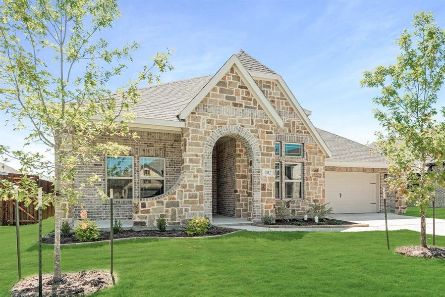 Stone and brick facade with an arched entry Stone and brick facade with an arched entry