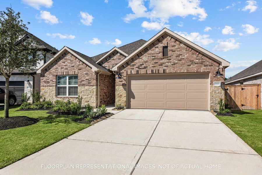 Front exterior of a new home in Moran Ranch, Willis, TX, highlighting curb appeal (Image 18).
