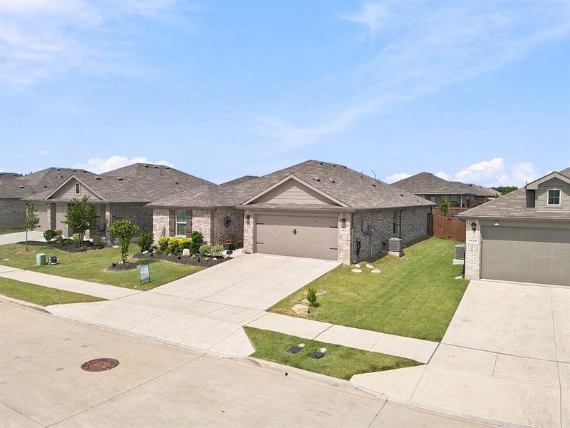 Front exterior of a new home in , Fort Worth, TX, highlighting curb appeal (Image 21). Front exterior of a new home in , Fort Worth, TX, highlighting curb appeal (Image 21).