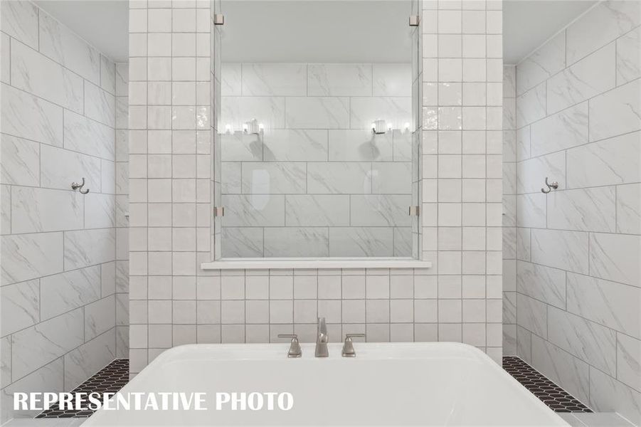 Our Justin plan features our signature bath with walk through shower and free standing tub!  REPRESENTATIVE PHOTO