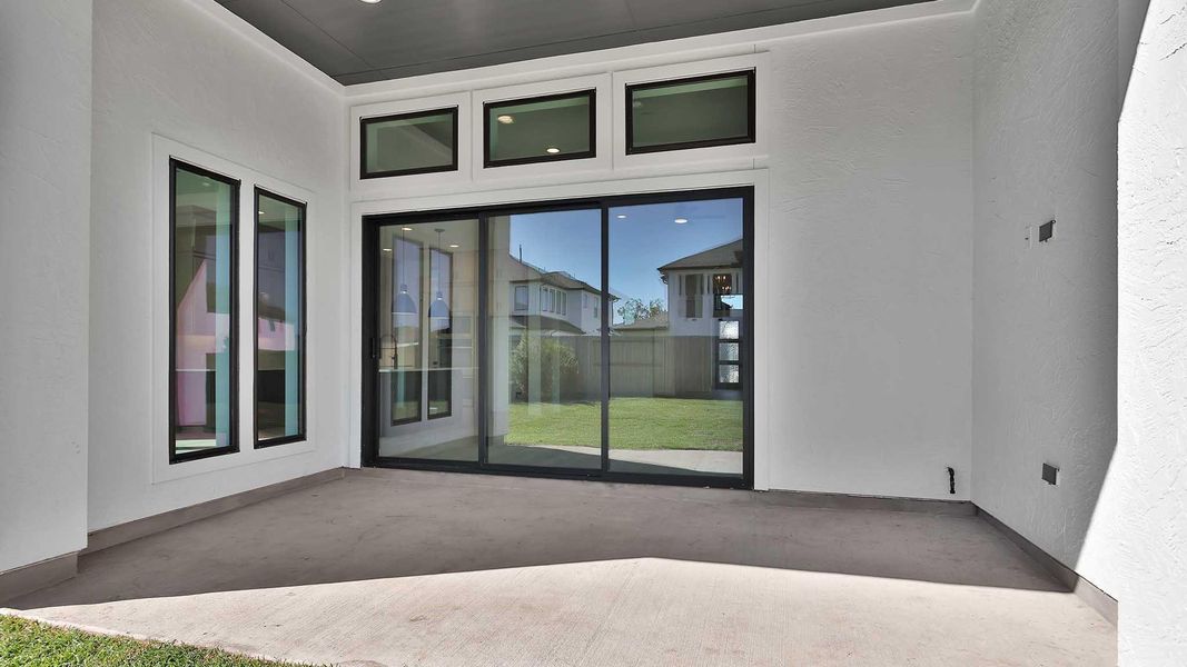 Exterior details and patio area of a home in Sienna 65' - Valencia, Missouri City (Image 2). Exterior details and patio area of a home in Sienna 65' - Valencia, Missouri City (Image 2).