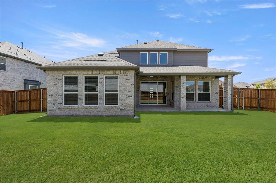 Front exterior of a new home in Spiritas Ranch, Little Elm, TX, highlighting curb appeal (Image 21).