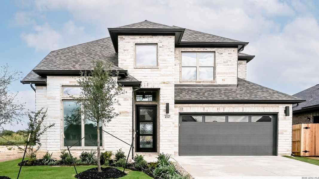 Front exterior of a new home in Legacy at Lake Dunlap, New Braunfels, TX, highlighting curb appeal (Image 2).