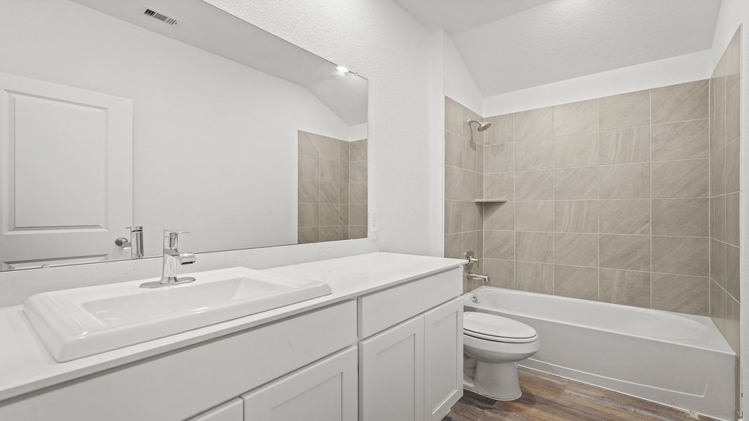 Furnished interior view inside a new home in Sunterra, Katy (Image 5).