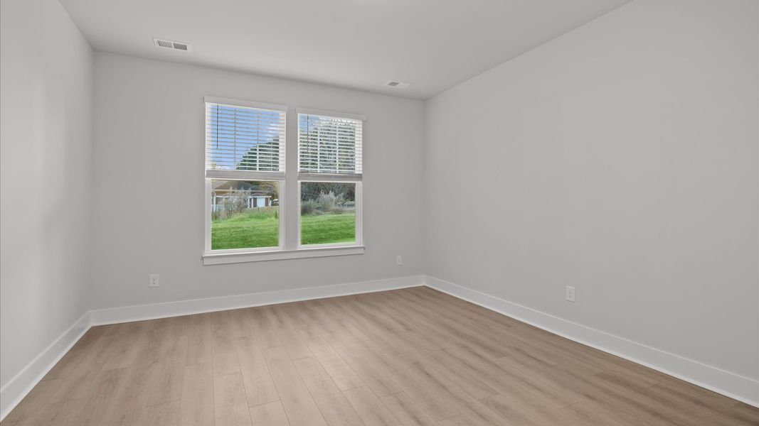 First-class hardwood floors and tasteful finishes elevate the private retreat of this exceptional primary suite First-class hardwood floors and tasteful finishes elevate the private retreat of this exceptional primary suite