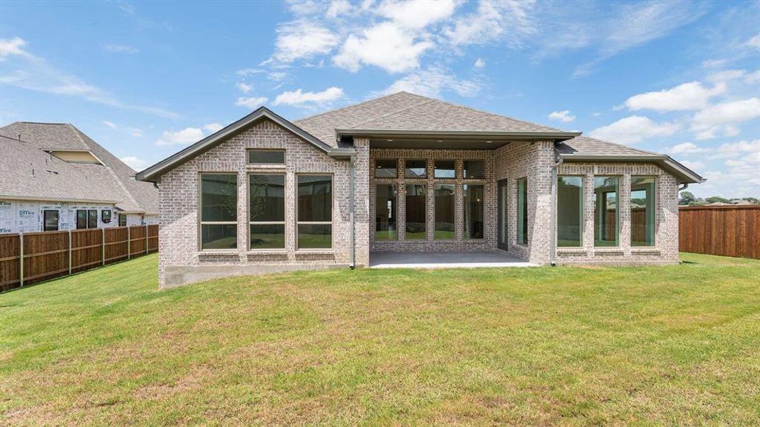 Front exterior of a new home in Talon Hills 60'/70', Fort Worth, TX, highlighting curb appeal (Image 2). Front exterior of a new home in Talon Hills 60'/70', Fort Worth, TX, highlighting curb appeal (Image 2).